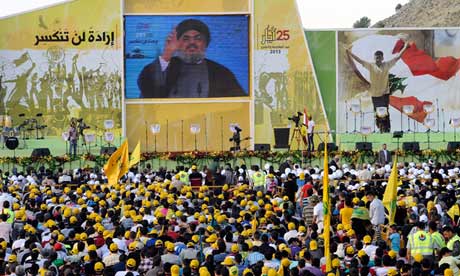 Supporters of Hezbollah watch Nasrallah's televised address in the village of Mashghara, Lebanon. Photograph: Wael Hamzeh/EPA