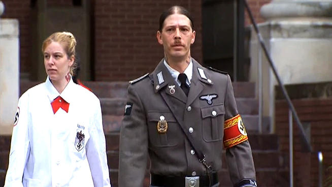 Heath Campbell, 40, walks out of Hunterdon County Family Court wearing a Nazi uniform after petitioning a judge to allow him to see his youngest son Hons. The 2-year-old and his siblings were removed from the father's care after allegations of abuse and a violent home surfaced. The father denies those claims.