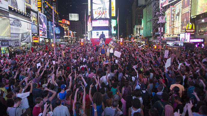 Protesters rally in response to the acquittal of George Zimmerman in the Trayvon Martin trial in Times Square in New York, July 14, 2013.