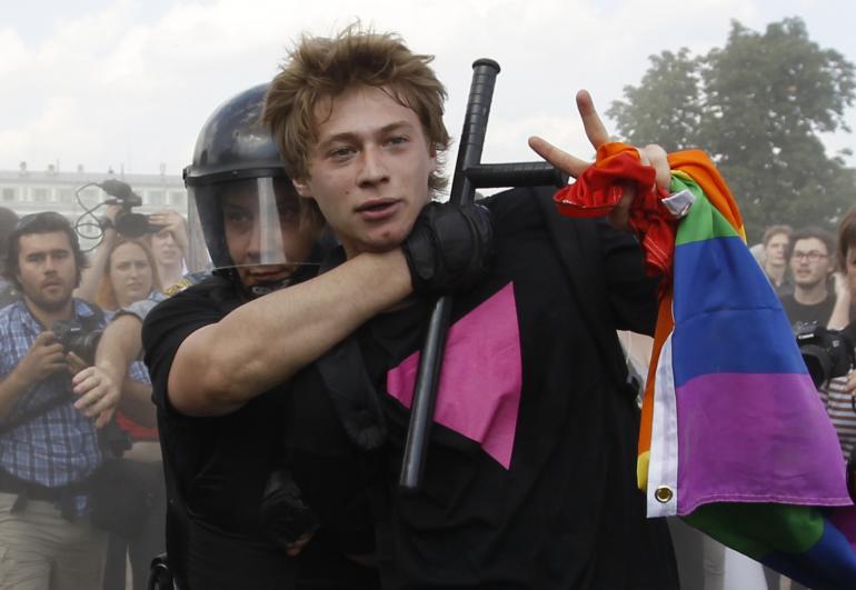 Police detain a gay rights activist during a Gay Pride event in St. Petersburg, June 29, 2013. Dozens of gay and lesbian rights activists and their supporters gathered for the event but were attacked by anti-gay protesters and later dispersed by the police. Reuters.