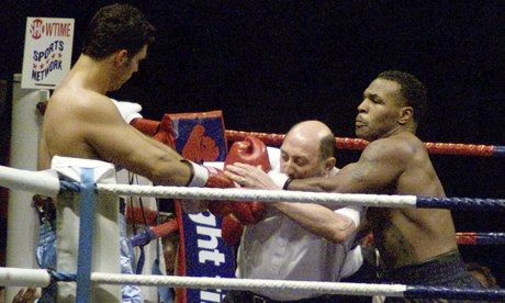 tyson ignoring the refferee to punch through him