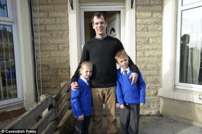 Dad Justin Tutt and his children Leigh and Seth who face being taken away from their father and put into care 8,500 miles away in South Africa.