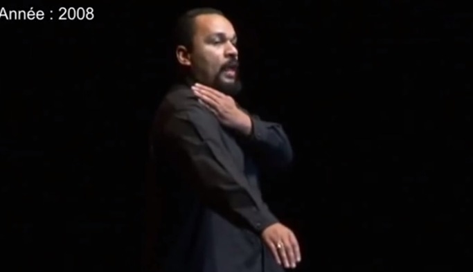 French comedian Dieudonne M'bala M'bala performs the Quenelle gesture in 2008.