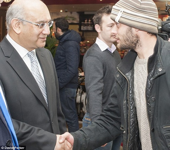 Labour's Keith Vaz greets one of the first Romanian immigrants to arrive in the UK on January 1