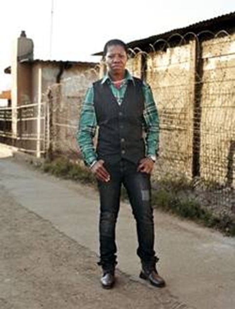 Mvuleni stands in the alley where she was abducted
