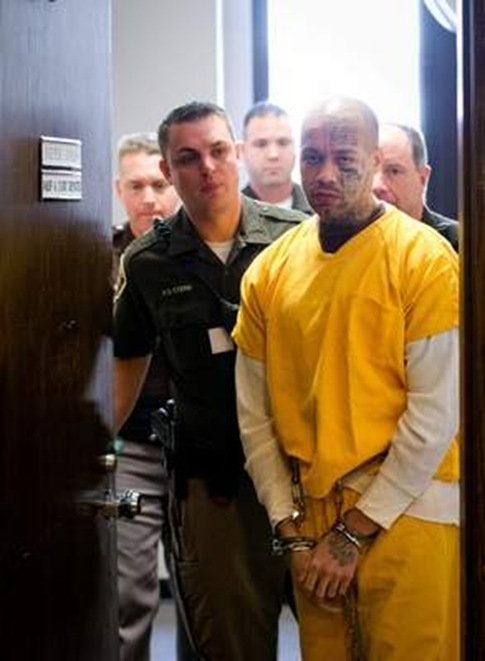 Nikko Jenkins is led in and out of Judge Peter Bataillon's courtroom at the Douglas County Courthouse in Omaha in November