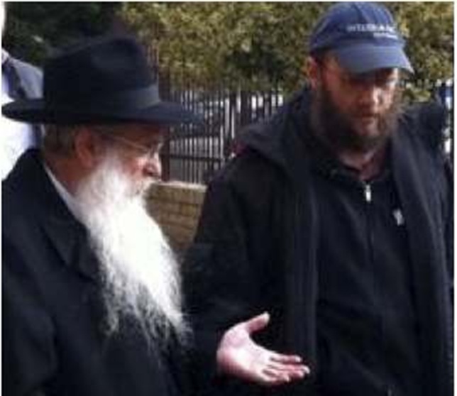 David Cyprys, right, walking with Chabad leader Rabbi Avrohom Glick