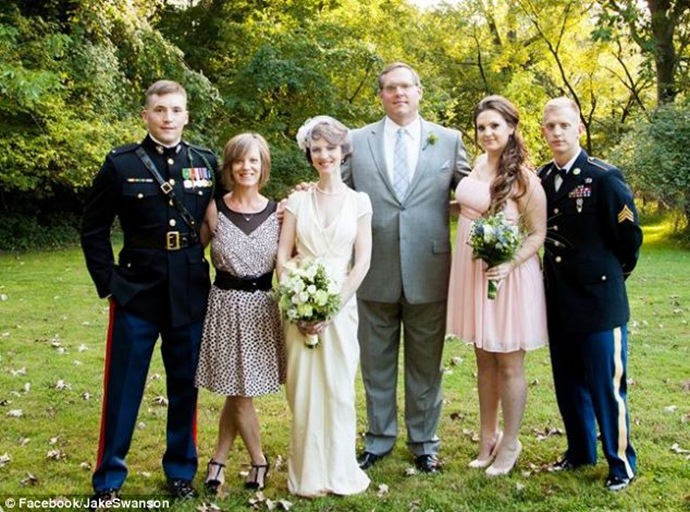 Hannah comes from a middle class family. Here she is pictured at a family wedding with her two military brothers, mother and father, Roland