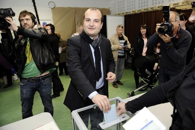 Front National candidate David Rachline smiles as he cast his ballot during the municipal elections in Frejus, on March 23, 2014