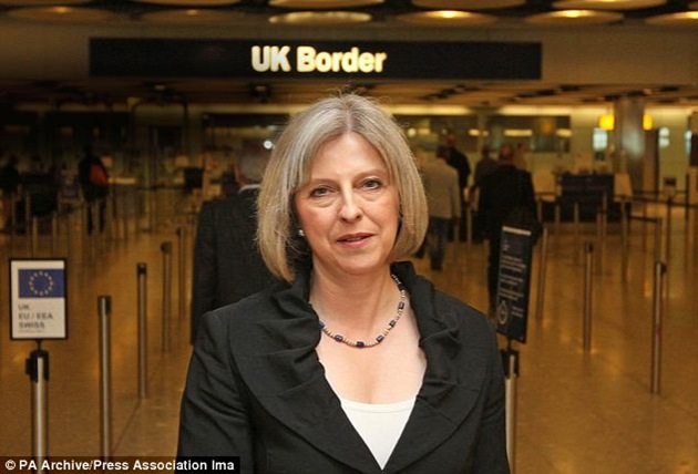 Home Secretary Theresa May stands by the border gate at Heathrow The BBC's top news yesterday was that the Government was burying a report that undermined the Home Secretary's case for border controls