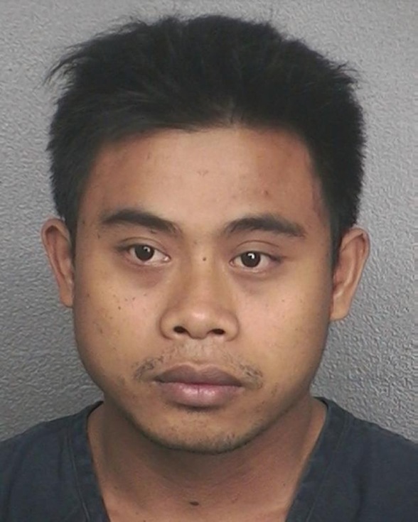 Ketut Pujayasa, 28, a former Holland America cruise worker, allegedly confessed to raping and trying to throw a passenger overboard on Valentine's Day during a cruise that left Fort Lauderdale, Fla.