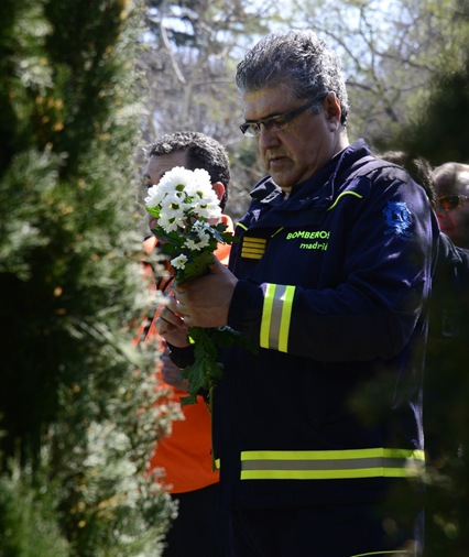 Local Police wait to lays flowers during a commemoration ceremony in held in the Rememberance Garden of Madrid's Retiro Park on March 11, 2014
