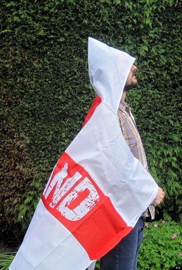 A man wears a "wearable England flag" made by Asda, as the supermarket defended the flag after claims it resembles a Ku Klux Klan outfit. PRESS ASSOCIATION Photo. Picture date: Friday May 30, 2014. The £3 St George's Cross, with the word "England" on the red cross, features a hood which Asda said was to allow fans to wear it and stay dry despite the unpredictable British weather. See PA story CONSUMER Flag. Photo credit should read: Carmel Wilkinson/PA Wire