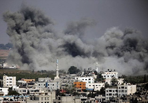 1406870416517_wps_1_Smoke_rises_after_an_Isra