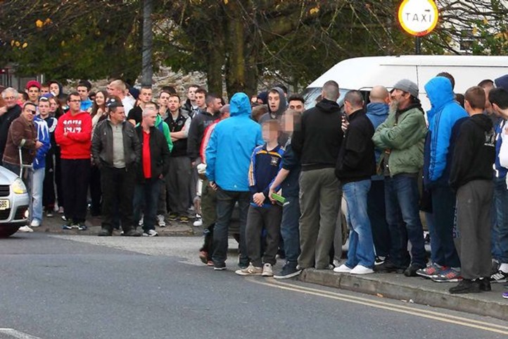 A-crowd-gathers-outside-the-house