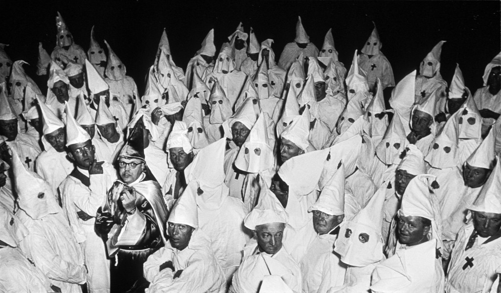 Traditionally, the KKK was a racist group trying to stop the Jews.  Now it is a non-racist group, trying to take down the illuminati conspiracy.