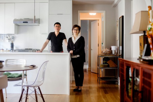 Yi Lin and his wife, Molly Xi, in their new home in Manhattan. They got green cards for investing in American real estate. (Not the new home, some development in Miami.)