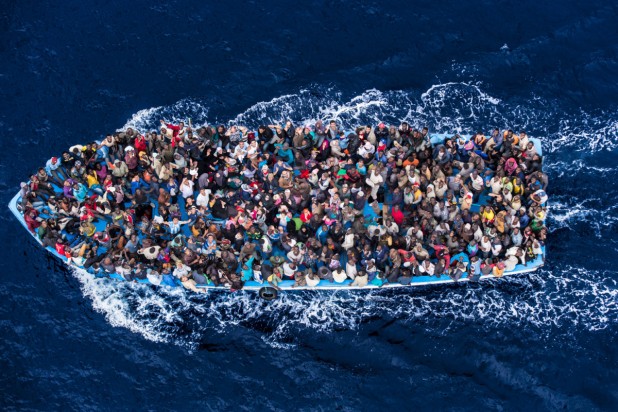 June 7, 2014 - Mediterranean Sea / Italy: Italian navy rescues asylum seekers traveling by boat off the coast of Africa. More than 2,000 migrants jammed in 25 boats arrived in Italy June 12, ending an international operation to rescue asylum seekers traveling from Libya. They were taken to three Italian ports and likely to be transferred to refugee centers inland. Hundreds of women and dozens of babies, were rescued by the frigate FREMM Bergamini as part of the Italian navy's "Mare Nostrum" operation, launched last year after two boats sank and more than 400 drowned. Favorable weather is encouraging thousands of migrants from Syria, Eritrea and other sub-Saharan countries to arrive on the Italian coast in the coming days. Cost of passage is in the 2,500 Euros range for Africans and 3,500 for Middle Easterners, per person. Over 50,000 migrants have landed Italy in 2014. Many thousands are in Libya waiting to make the crossing. (Massimo Sestini/Polaris)