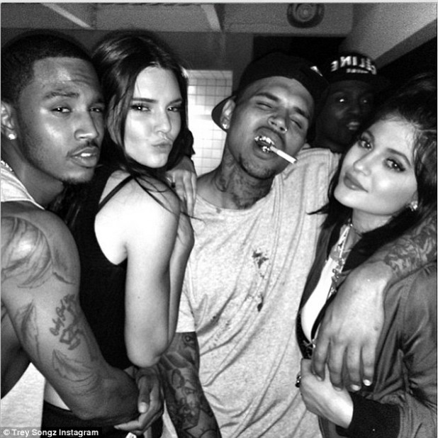 Tranny Bruce Jenner's daughters. Tyga middle.