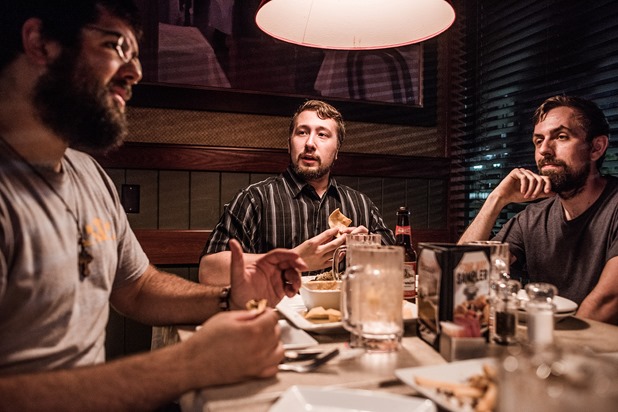 From left, Mathew Heimbach, Scott Hess and Tony Hovater eat dinner at Ruby Tuesdays after a confederate flag rally held in a parking lot in Seymour, Tennessee on Thursday, July 17, 2015. Host Tom Pierce, and guest, Mathew Heimbach delivered speeches before prompting the group to drive with flags raised through Knoxville.  Mike Belleme for Al Jazeera America 