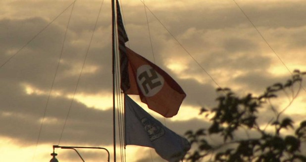 The swastika was flown between the US and UN flags.