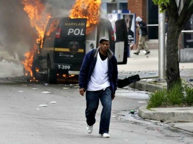 Burning-police-van-and-man-walking-in-Baltimore-AP-Photo-640x480