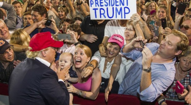 MOBILE, AL- AUGUST 21: Republican presidential candidate Donald Trump greets supporters after his rally at Ladd-Peebles Stadium on August 21, 2015 in Mobile, Alabama. The Trump campaign moved tonight's rally to a larger stadium to accommodate demand. (Photo by Mark Wallheiser/Getty Images)