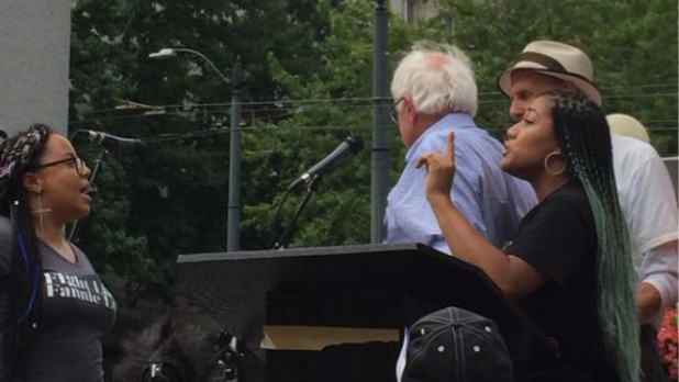 Bernie (in blue) walks off without being allowed to speak