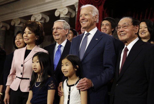 U.S. Senate Majority Leader Mitch McConnell (3rd L) and his family pose with Vice President Joseph Biden (4th R) after McConnell ceremonially swore-in, in the Old Senate Chamber on Capitol Hill in Washington January 6, 2015.      REUTERS/Larry Downing   (UNITED STATES - Tags: POLITICS) - RTR4KAPN