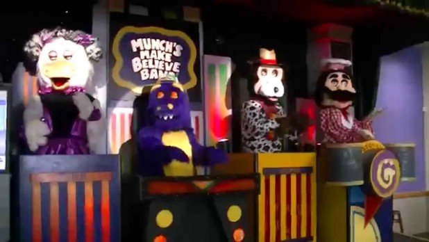For those outside of the US, Chuck E. Cheese is a chain of restaurant-sized mini theme parks (I guess that's what you would call them) featuring games and animatronic music shows. I have fond memories of going there as a kid, and can actually remember down syndrome adults also enjoying the fun.