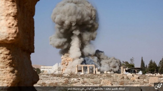 One of the online images released by Islamic State militants on Aug. 25, 2015, shows the explosion and fuming smoke following the demolition of the temple of Baal Shamin in Syria's ancient city of Palmyra. 