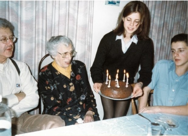 “We should be releasing these old wounds . . . “ Don Glass as a traumatized Holocaust survivor child victim (far right), enjoying tea and cake with his traumatized Jewish family in London.