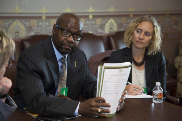 LIRS lobbyist (right) Brittney Nystrom with unidentified man delivering demand for MORE SYRIAN REFUGEES at White House meeting. Recently Nystrom said LIRS wants 100,000 Syrians admitted in the next year here: https://refugeeresettlementwatch.wordpress.com/2015/10/21/lutheran-lobbyist-says-100000-syrians-is-a-responsible-number-for-fy2016/