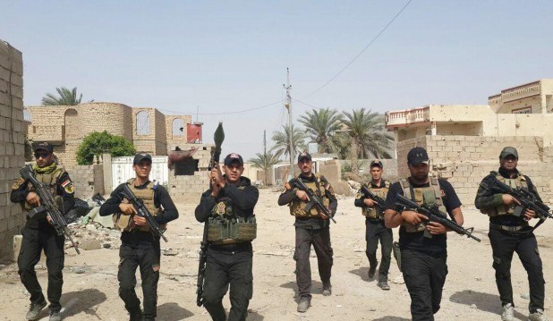 Iraqi anti-terrorism forces patrol in central Ramadi, Iraq, Saturday, April 18, 2015. In Iraq's western Anbar province, Iraqi special forces maintained control of the provincial capital, Ramadi, after days of intense clashes with the Islamic State group left the city at risk. Sabah Nuaman, a special forces commander in Anbar, said the situation had improved after airstrikes hit key militant targets on the city's fringes. (AP Photo)