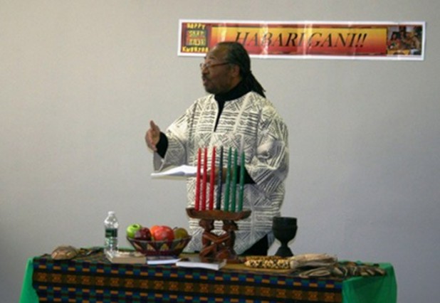 James Conyers, director of the “Office of Africana Studies,” officiates at a “Kwanzaa” celebration.