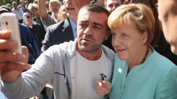 Merkel-Visits-Migrants-Shelter-And-School