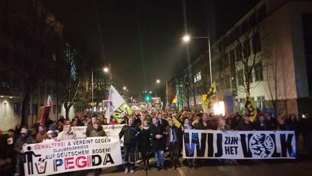 The Vlaams Belang delegation, right, at the head of the weekly march to Dresden’s Theaterplatz. Their banner reads “We are the people.”