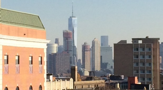 The view of One World Trade Center, as seen from a Jersey City rooftop. “Some men were dancing, some held kids on their shoulders.” 