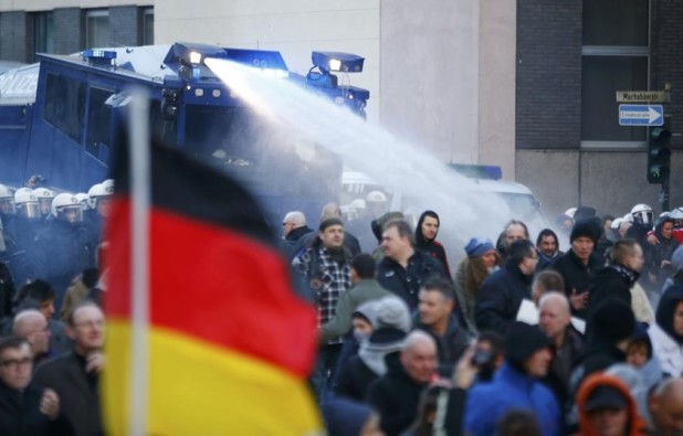 German anti-rape protesters attacked with water cannon by police on January 9, 2016.