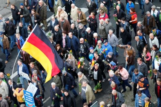 Supporters of the right-wing Alternative for Germany (AfD) demonstrate against the German government's new policy for migrants in Berlin