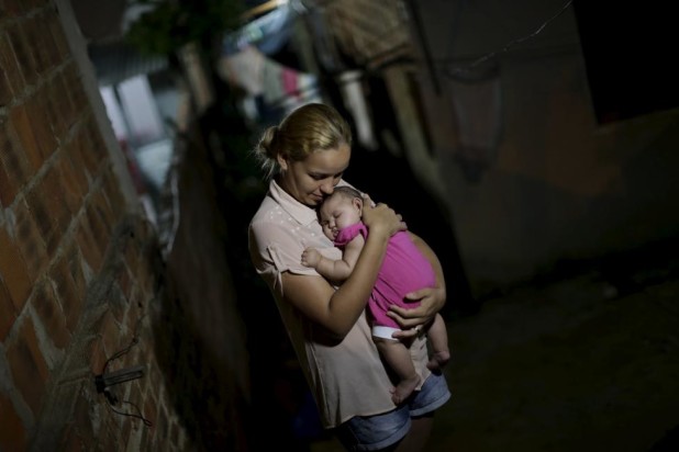 Gleyce Kelly embraces her daughter Maria Geovana, who has microcephaly, in Recife, Brazil, January 25, 2016. REUTERS/Ueslei Marcelino