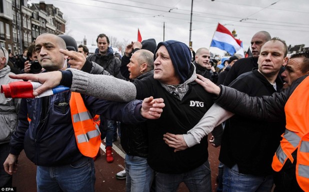 30F15D4800000578-3435093-Members_of_the_Dutch_PEGIDA_movement_march_through_the_city_cent-a-20_1454797210647
