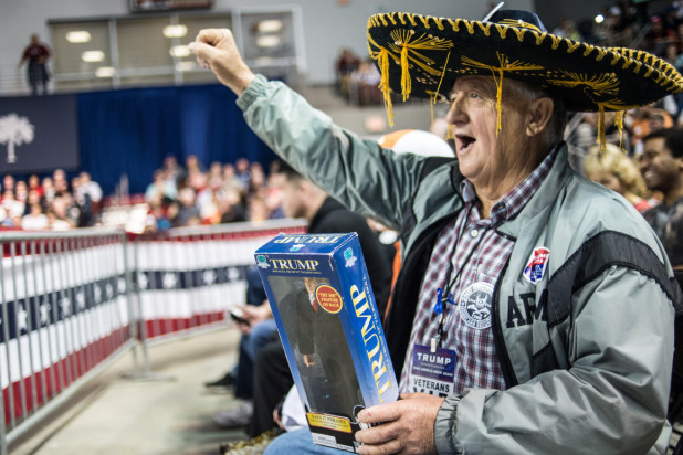 AIKEN, SC - DECEMBER 12, 2015:  Jim Yates, a Donald Trump supporter from Laurens, South Carolina cheers for the candidate before a town hall meeting Saturday, December 12, 2015 in Aiken, South Carolina. The South Carolina Republican primary is scheduled for February 20, 2016. (Photo by Sean Rayford/Getty Images)