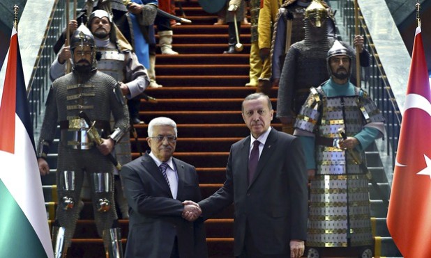 Recep Tayyip Erdo?an, right, shakes hands with his Palestinian counterpart Mahmoud Abbas