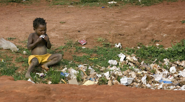 A child scavenges for food in a garbage pit near Malanje, Angola. United Methodist bishops in Africa have issued a Sept. 11 letter outlining new actions to combat poverty on the continent. The bishops that make up the church's African College of Bishops expressed "righteous indignation at the current plight of our continent" and resolved to work with professional, community and nongovernmental organizations and agencies to alleviate poverty in Africa. They met Sept. 8-11 at Africa University in Mutare, Zimbabwe. A UMNS file photo by Mike DuBose. Photo #080868. Accompanies UMNS story #382. 9/15/08.