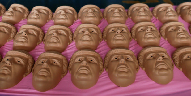 Masks of U.S. Republican presidential candidate Donald Trump are seen at Jinhua Partytime Latex Art and Crafts Factory in Jinhua, Zhejiang Province, China, May 25, 2016. There's no masking the facts. One Chinese factory is expecting Donald Trump to beat his likely U.S. presidential rival Hilary Clinton in the popularity stakes. At the Jinhua Partytime Latex Art and Crafts Factory, a Halloween and party supply business that produces thousands of rubber and plastic masks of everyone from Osama Bin Laden to Spiderman, masks of Donald Trump and Democratic frontrunner Hillary Clinton faces are being churned out. Sales of the two expected presidential candidates are at about half a million each but the factory management believes  Trump will eventually run out the winner. "Even though the sales are more or less the same, I think in 2016 this mask will completely sell out," said factory manager Jacky Chen, indicating a Trump mask. REUTERS/Aly Song SEARCH "JINHUA MASK" FOR THIS STORY. SEARCH "THE WIDER IMAGE" FOR ALL STORIES. - RTX2EBDA