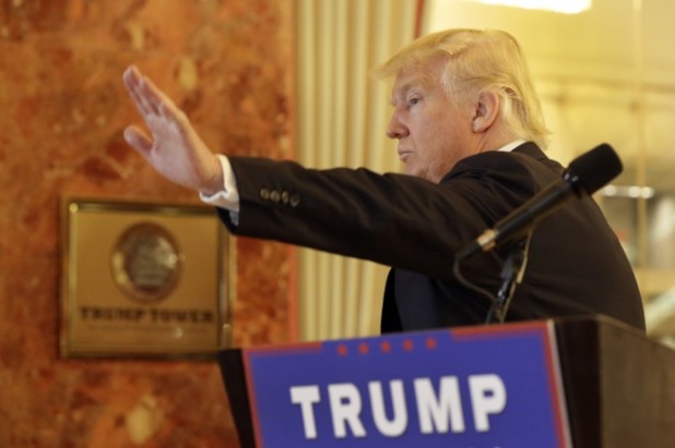 Republican presidential candidate Donald Trump waves as he leaves a news conference in New York, Tuesday, May 31, 2016. (AP Photo/Richard Drew)