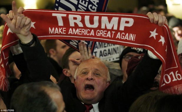 310AF34500000578-3439859-A_supporter_holds_a_scarf_bearing_Trump_s_slogan_as_he_waits_for-a-33_1455099425321