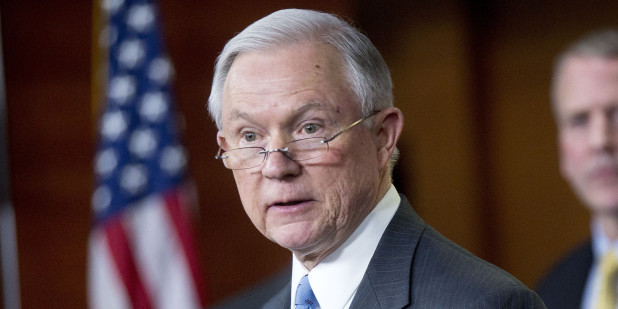 Senator Jeff Sessions, a Republican from Alabama, speaks during a news conference on the Department of Homeland Security (DHS) funding bill with Senator Dan Sullivan, a Republican from Arkansas, right, in Washington, D.C., U.S., on Thursday, Feb. 12, 2015. The DHS is operating under a continuing resolution that expires on Feb 27 with a stalemate over whether the must-pass measure should carry riders to upend President Barack Obama's immigration policies continuing to threaten passage of the legislation. Photographer: Andrew Harrer/Bloomberg via Getty Images