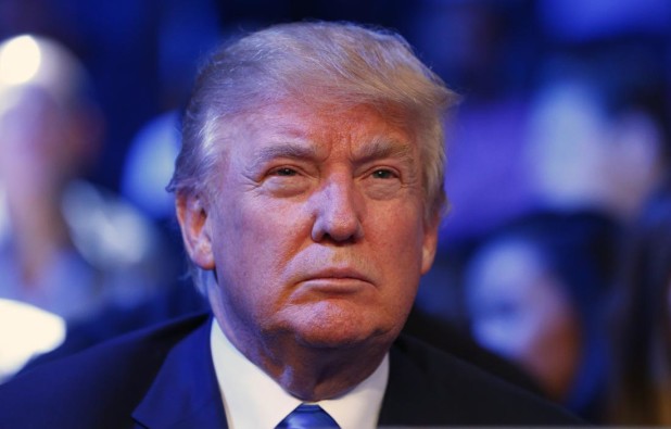 Republican presidential candidate Donald Trump watches as Luis Ortiz fights Matias Ariel Vidondo of Argentina during a WBA heavyweight title bout at Madison Square Garden in New York on Saturday, Oct. 17, 2015. Ortiz won by a knockout in the third round. (AP Photo/Rich Schultz)